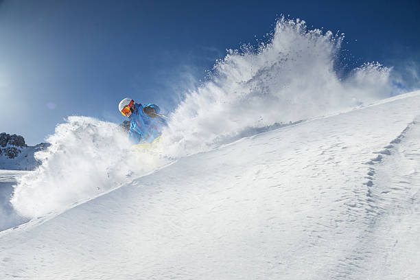istock Skier skiing downhill in high mountains 537290759