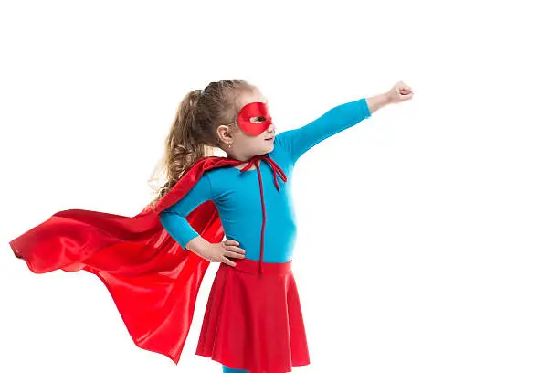 Superhero child (girl), isolated on white background.