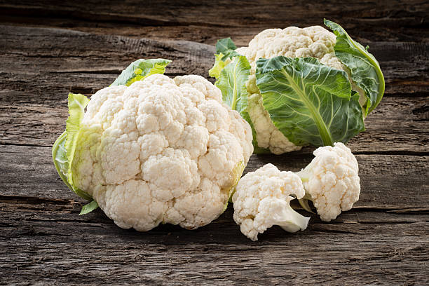 istock Organic cauliflower on wooden background 537292367