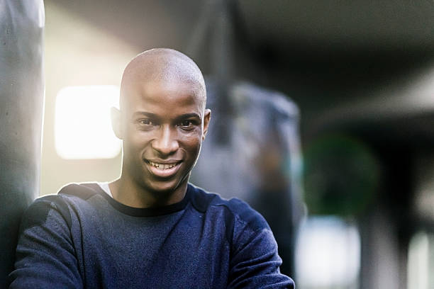 istock Boxing coach smiling in gym 537292692