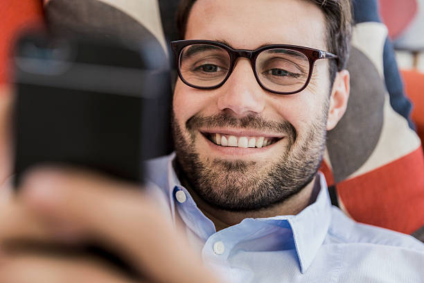 istock Happy businessman using smart phone in office 537293486
