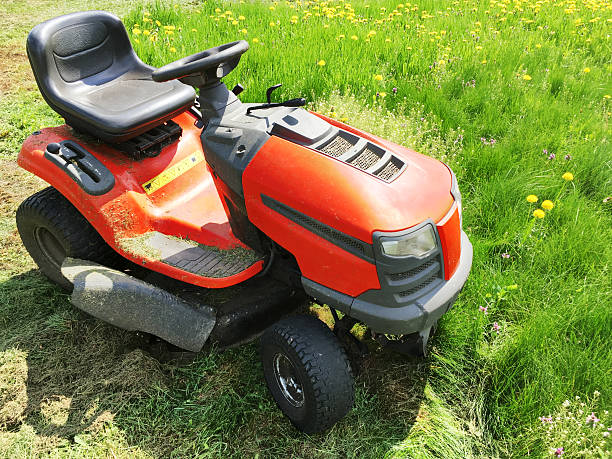 istock red lawn mover cutting green grass on garden field 537295202