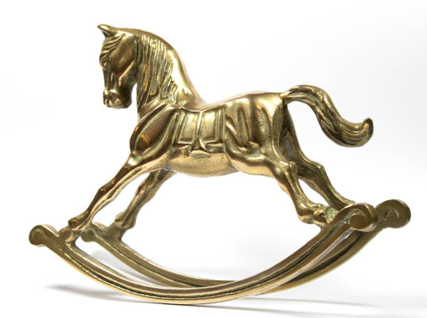 istock Brass Rocking Horse on White Background 537295868