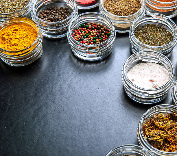istock Spices on black background in special jars. Food 537296038