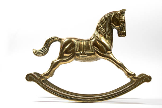 istock Brass Rocking Horse on White Background 537297108