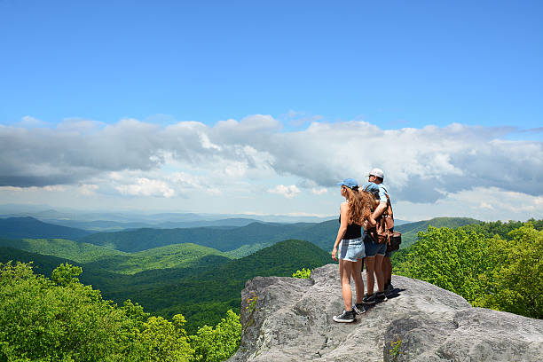 istock Family hiking in autumn mountains. 537297316