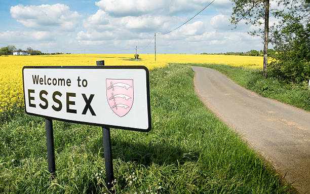 Welcome to Essex sign, UK A rural English countryside scene on a bright spring day with a sign welcoming travellers to the English county of Essex. essex england photos stock pictures, royalty-free photos & images
