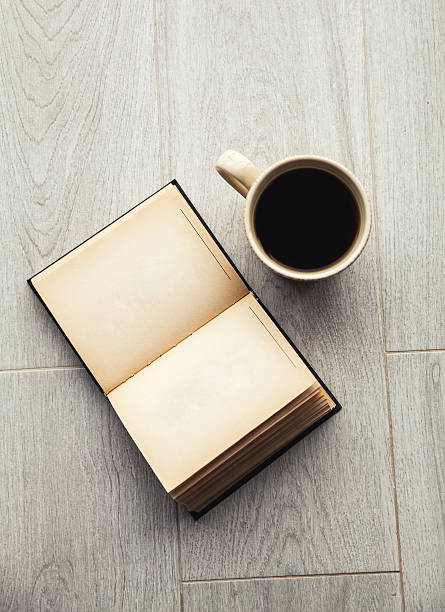 istock Large cup of coffee and open book. Education, hobby, drink. 537298564