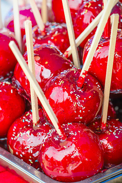 istock Sweet glazed red toffee candy apples on sticks 537299372