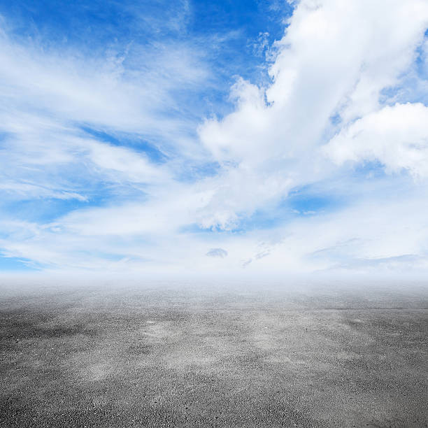 istock Gray empty road goes into the misty distance 537299436