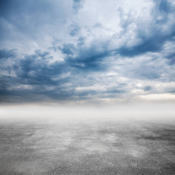 istock Empty road goes in fog under cloudy sky 537299870
