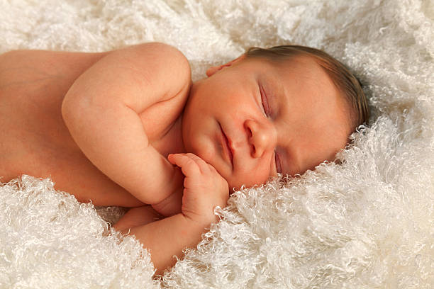 istock One week old baby on white blanket 537303298