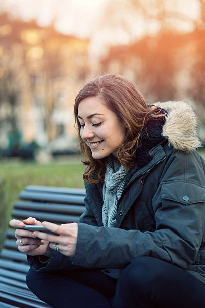 istock Young girl texting on smart phone 537304386
