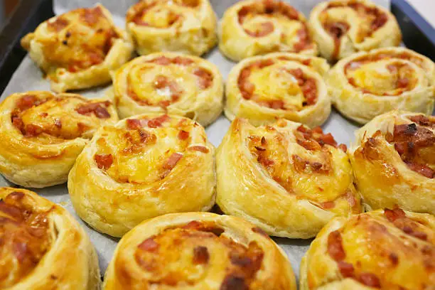 rolled baking of puff-paste with cheese and ham