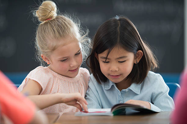 istock Girl Reading a Book Together 537309220