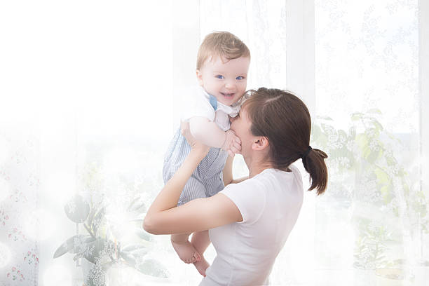istock Young mother holding her newborn child. 537310292