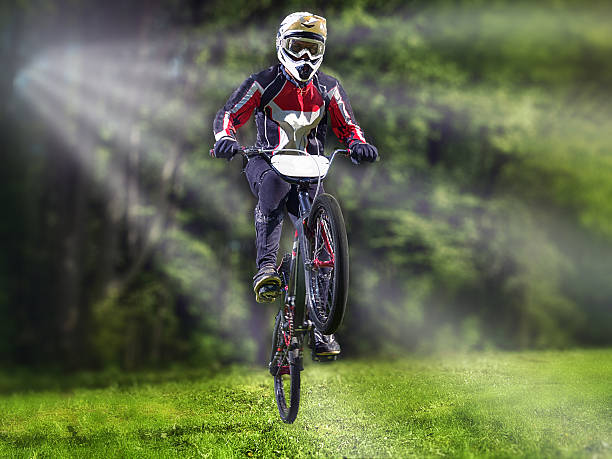 istock Man riding bmx bike performing a trick 537310786