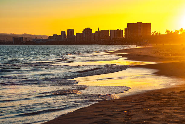 istock golden sunset over Long Beach Skyline 537310802