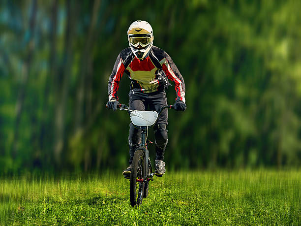 istock Young bmx bicycle rider on background of trees 537311000