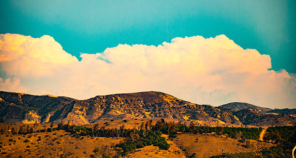 istock Orange clouds at sunset over the mountains 537311120
