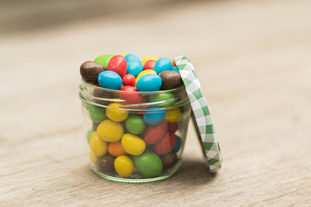 istock Jar of  colored chocolate covered peanuts 537311186