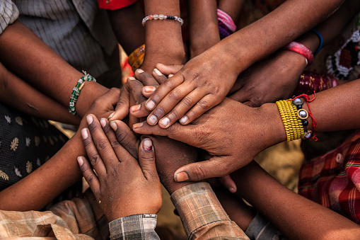 Children's hands in one of Indian villages showing unity. 