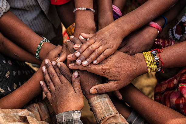 Unity of Indian children, Asia Children's hands in one of Indian villages showing unity.  south asia stock pictures, royalty-free photos & images
