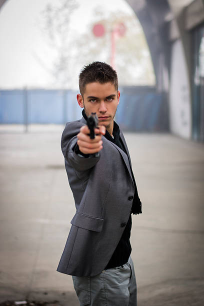 istock Detective, mobster or policeman aiming a firearm 537315133