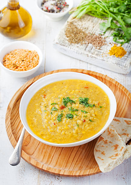 istock Lentil soup with pita bread in a ceramic white bowl 537315146
