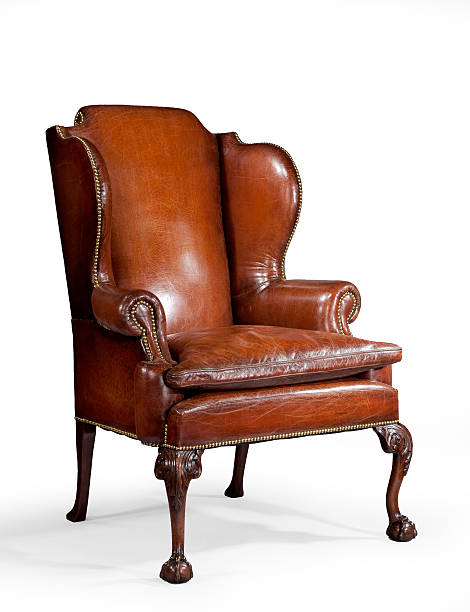 istock antique leather wing chair carved legs isolated with clip path 537315389