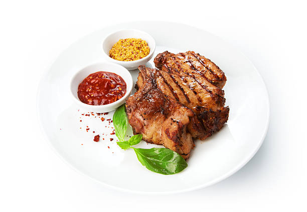 istock Restaurant food isolated - grilled pork chops with sauces 537316255