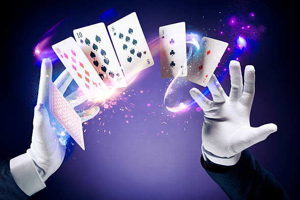 istock High contrast image of magician making card tricks 537317103
