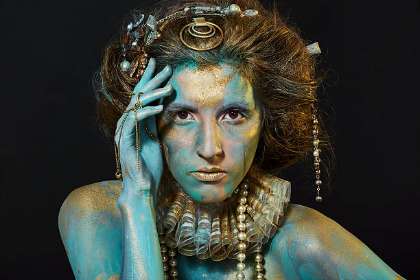 istock Model with gold and green body art. 537317128