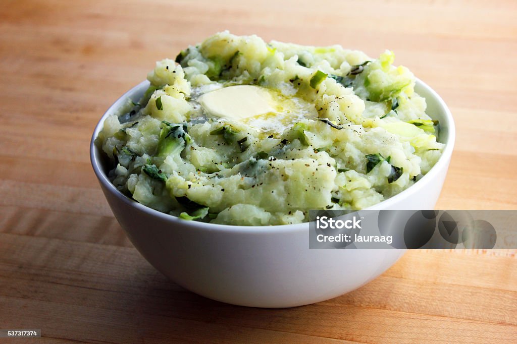 Colcannon A bowl of colcannon with a pat of butter on top Prepared Potato Stock Photo