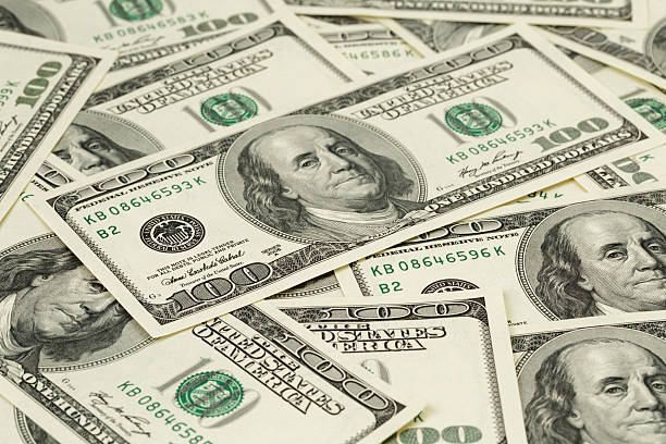 istock lots of one hundred dollar banknotes, background 537318067