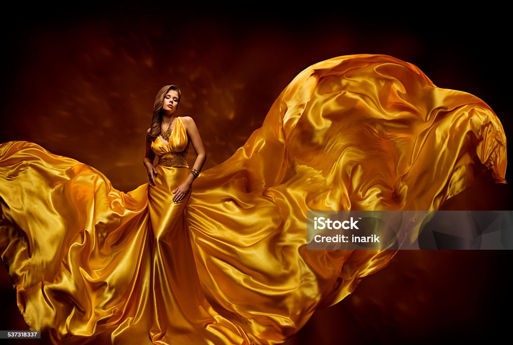 Fashion Model Woman Dress, Fluttering Silk Beauty Gown, Waving Fabric Fashion Model Woman Dress, Lady In Fluttering Silk Beauty Gown, Fabric Waving On Wind, Beautiful Girl With Long Dynamic Flying Cloth Gold Colored Stock Photo