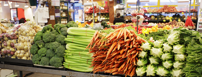 Broccoli, carrot and celery in bundles ready for sale at farmer's market in Vancouver, Canada.