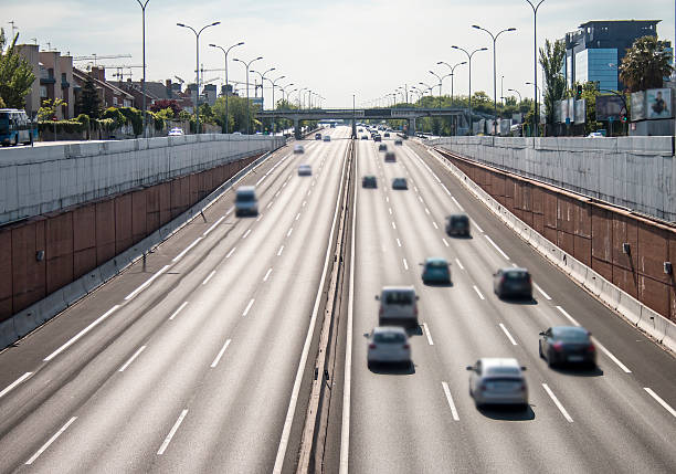 istock Moving cars on urban highway under sunlight 537319192