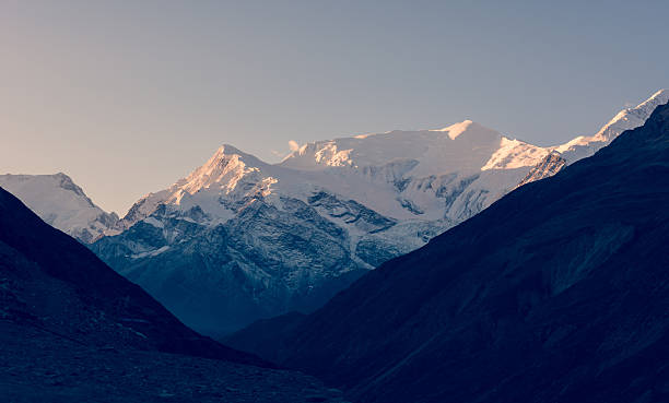 istock Snow covered mountain ridge at sunrise. 537319524
