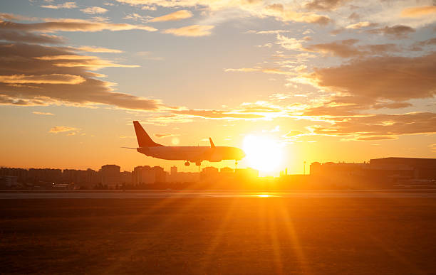 istock Sunset over Airplane Landing 537323916