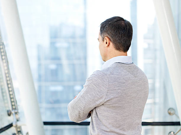 istock business person thinking by the windows 537329788