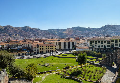 Cusco, Peru - August 22, 2014: Aerial view of central Cusco. The photo shows the colonial architecture, and a busy street with pedestrian and vehicular activity.