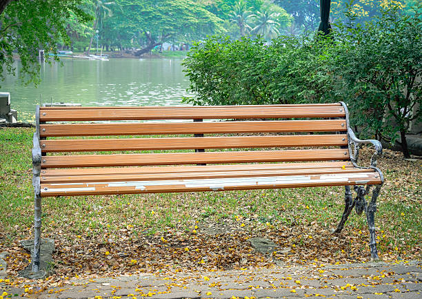 istock Old brown chair in city park 537336874