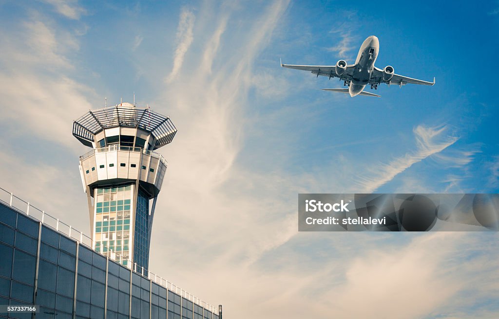 Air Trafic Control tower and airplance at Paris Airport Air Trafic Control tower and airplance at Orly, Paris Airport Air Traffic Control Tower Stock Photo