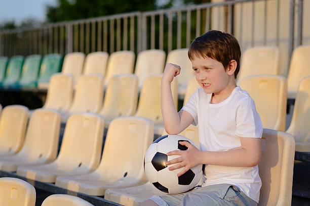 istock Disappointed little football fan 537337406