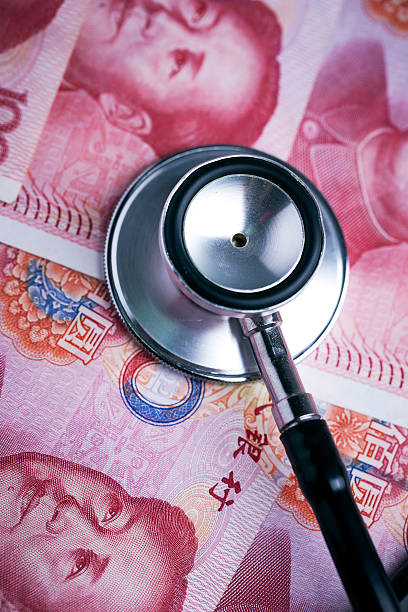 istock Chinese RMB bills and stethoscope 537337566
