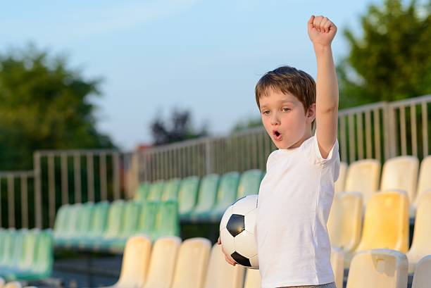 istock Little boy - football team fan 537337588