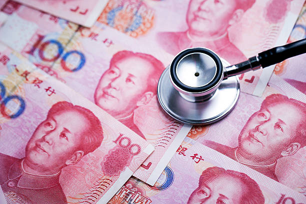 istock Chinese RMB bills and stethoscope 537337608