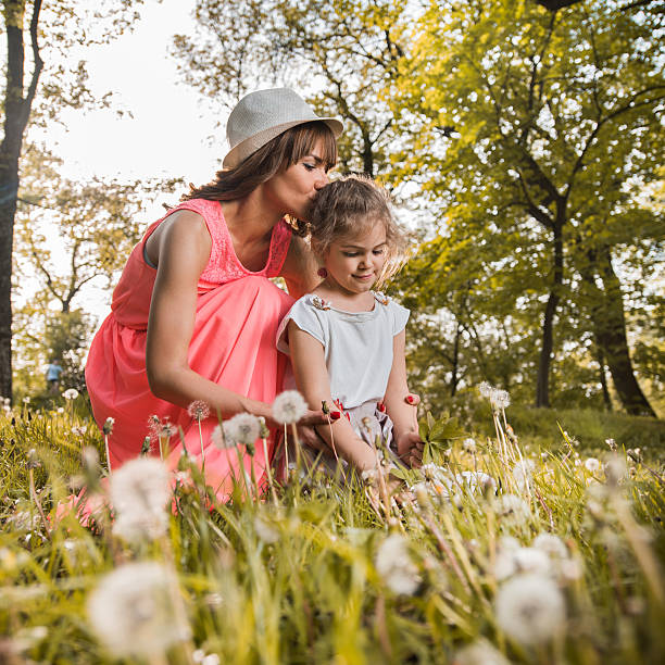 istock Affectionate mother and daughter during spring day in the forest. 537337766