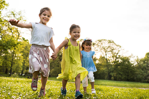 istock Carefree little friends having fun while running in the park. 537338210